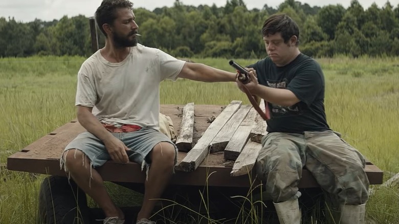 Zack Gottsagen Shia LeBeouf with gun