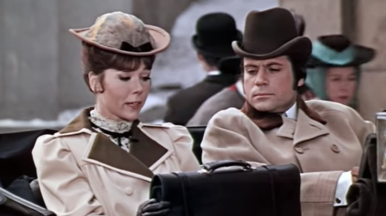 Diana Rigg and Oliver Reed sitting