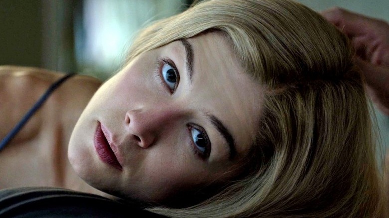 Rosamund Pike stares upward