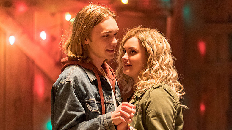 Mara and Dylan dance in a barn