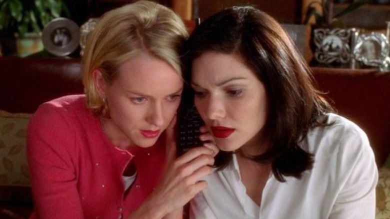 Betty and Rita listening to phone call