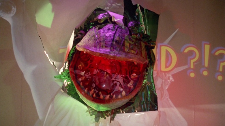 Audrey II bursting through movie screen