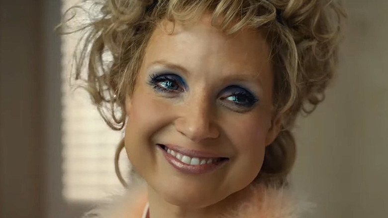 Tammy Faye smiles