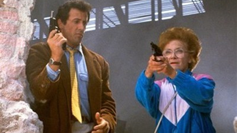 Stallone and Estelle Getty hold handguns