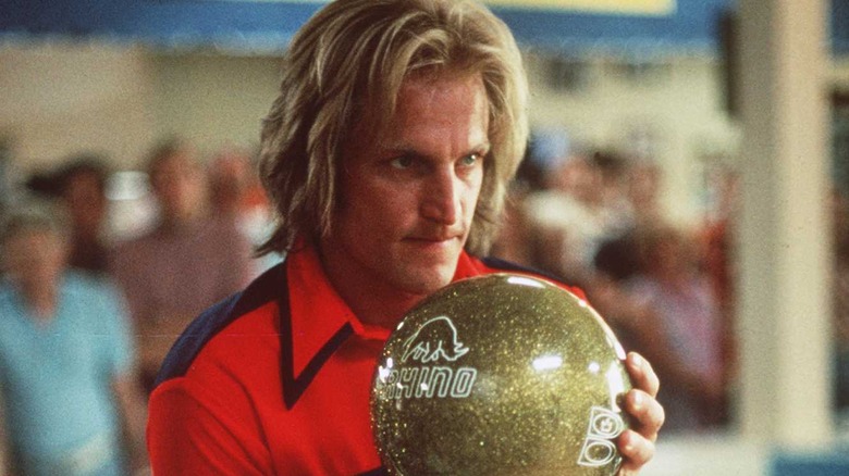 Woody Harrelson holds bowling ball