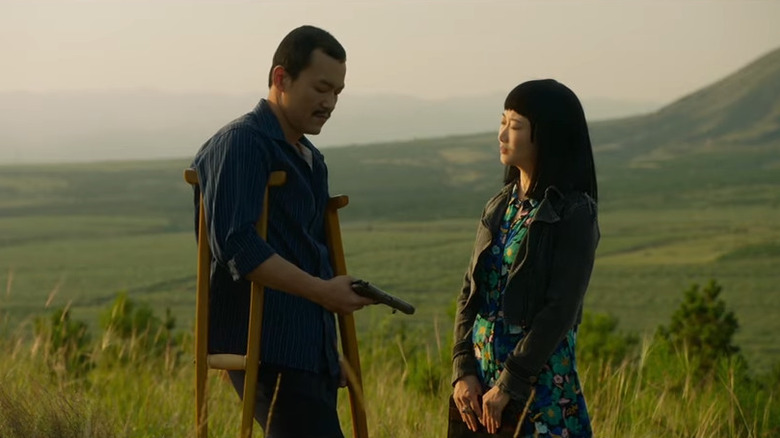 Fan Liao and Tao Zhao looking at a gun