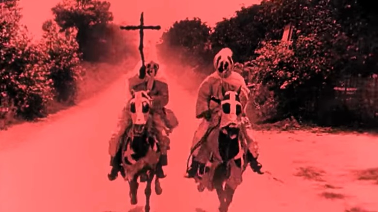 Klan members ride horses