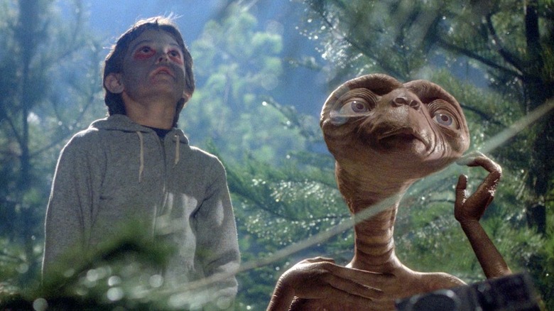 Elliot and E.T. in the woods