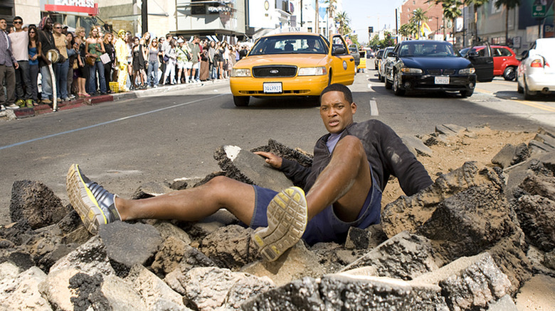 Hancock lying on road