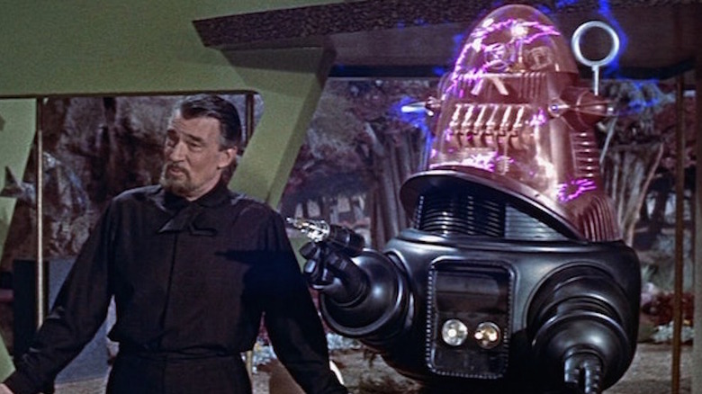 Morbius stands near Robby the Robot