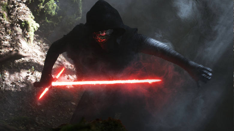 Kylo Ren holds lightsaber