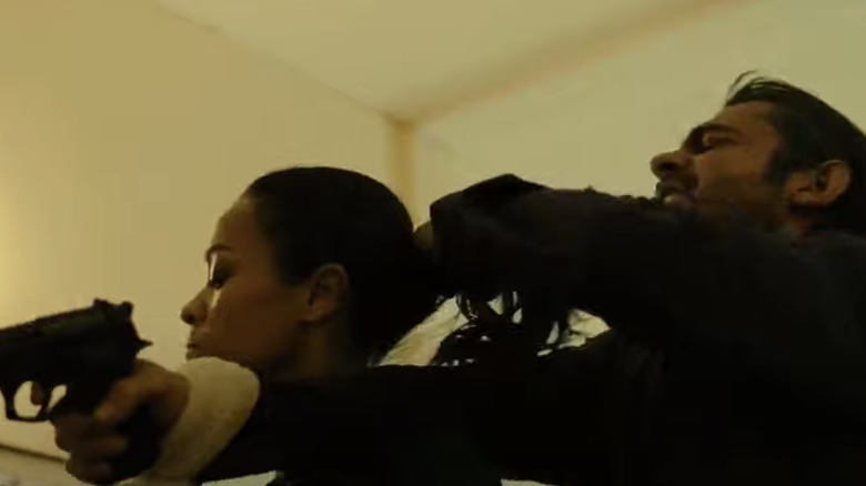 Zoe Saldana fighting with towel