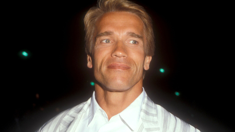 Arnold Schwarzenegger in white suit