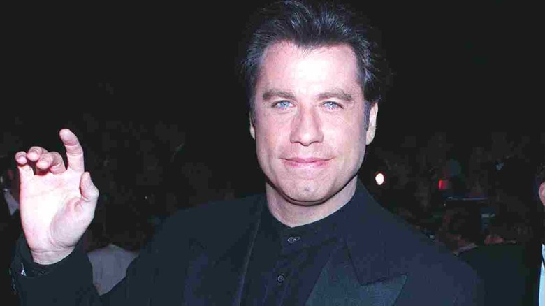 John Travolta waving