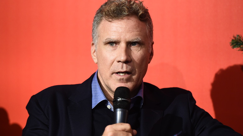 Will Ferrell talking on microphone