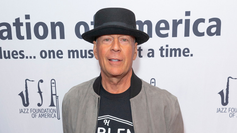 Bruce Willis wears a hat