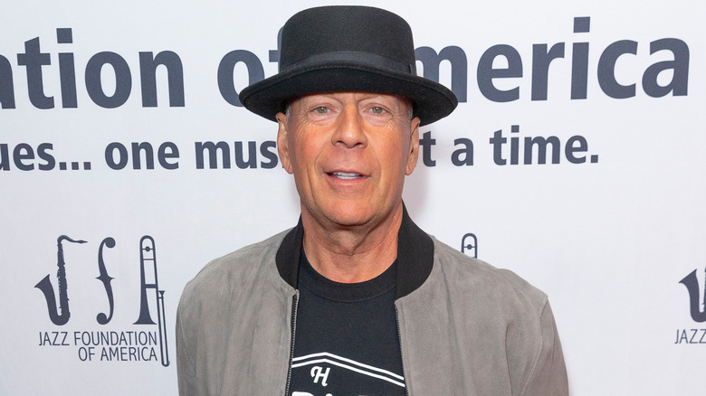 Bruce Willis wears a hat