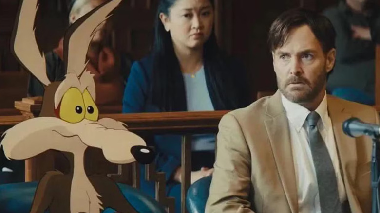 Wile E. Coyote sits with his lawyer in "Coyote vs. Acme" (2022)