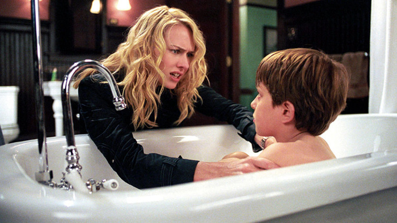 Rachel Keller checks on her child in the bathtub