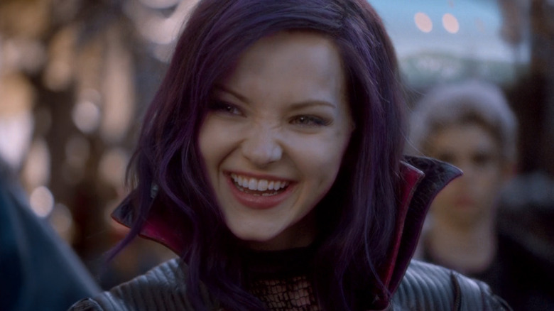 Mal smiling with purple hair