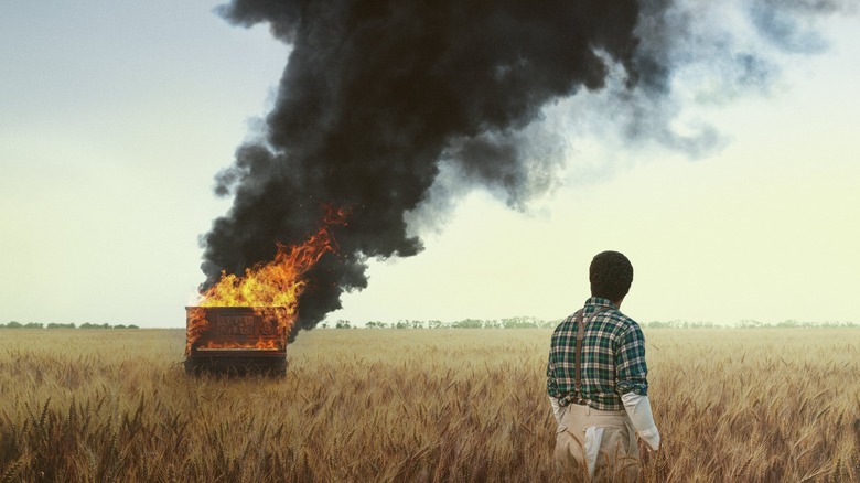 Piano burns in field