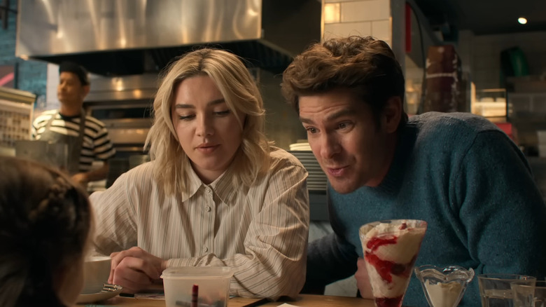 Andrew Garfield and Florence Pugh at table