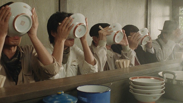 Diners slurping ramen from bowls