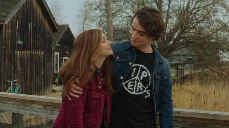 Mia and Adam walking together and smiling in If I Stay.