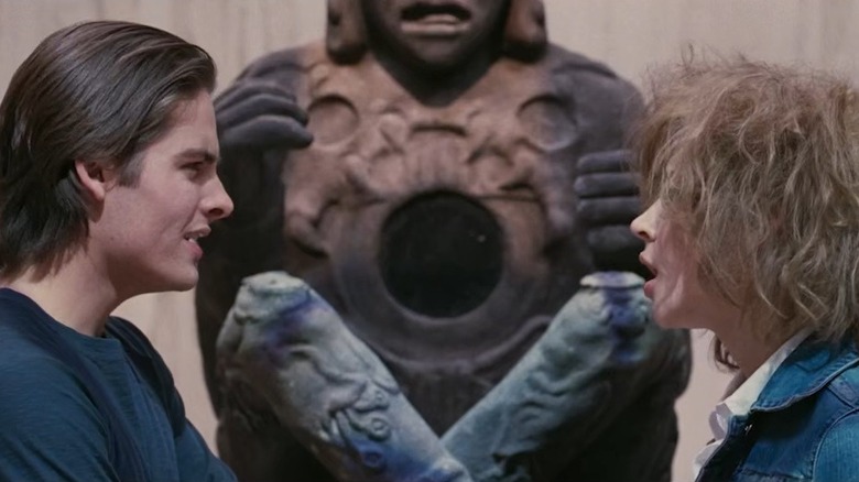 Kevin Zegers as Woody and Samaire Armstrong as Nell fighting in front of a statue in "It's a Boy Girl Thing."