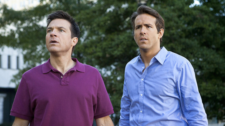 Jason Bateman as Dave and Ryan Reynolds as Mitch standing outside in "The Change-Up."