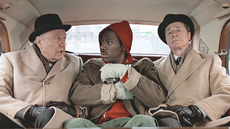 Ralph Bellamy as Randolph, Eddie Murphy as Billy Ray, and Don Ameche as Mortimer in the back seat of a car in "Trading Places."