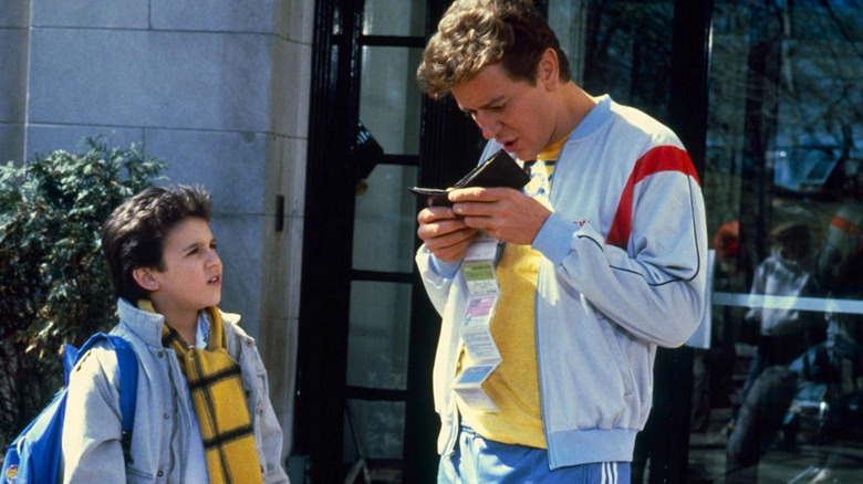 Fred Savage as Charlie and Judge Reinhold as Marshall standing outside in "Vice Versa."