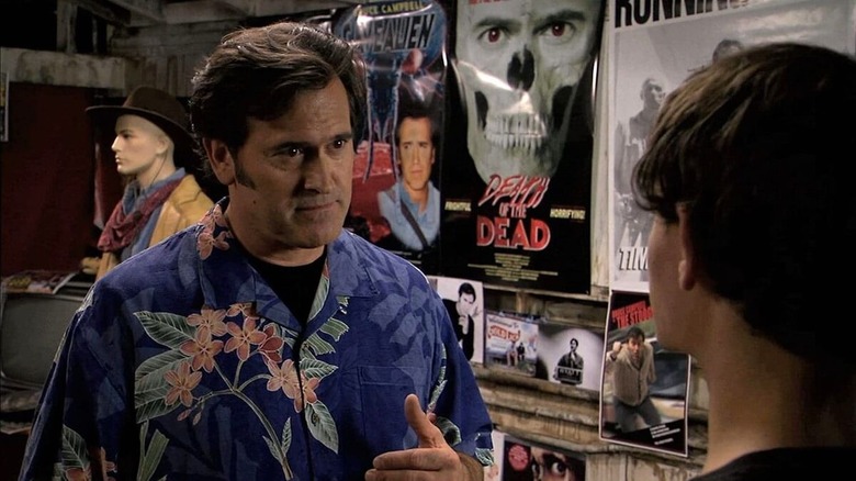 Bruce Campbell talks to a young man