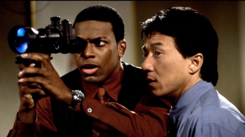 Detectives Carter and Lee looking through camera