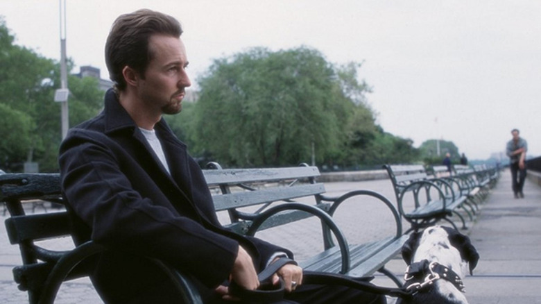 Edward Norton sits on bench