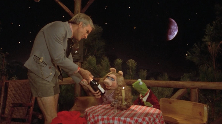 Steve Martin hands Miss Piggy wine