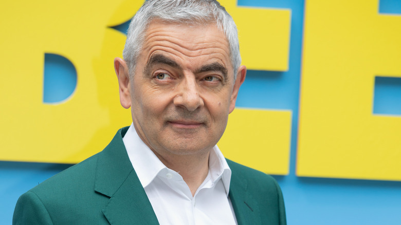 Rowan Atkinson in teal suit