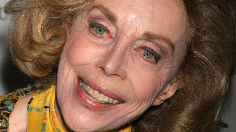 Dr Joyce Brothers smiles while tilting her head