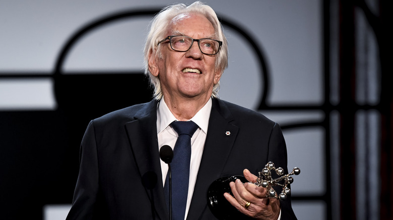 Donald Sutherland accepts award and holds status