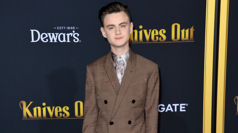 Jaeden Martell attends Knives Out event in brown suit 