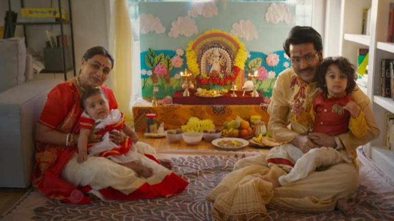 Debika, Aniruddha and their children posing