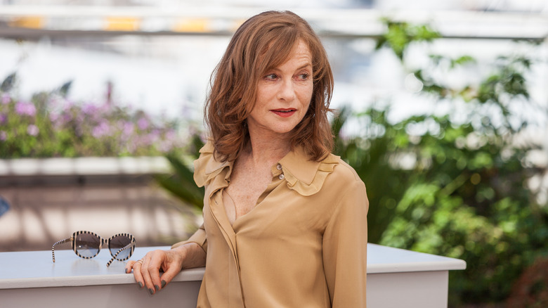 Isabelle Huppert looking on