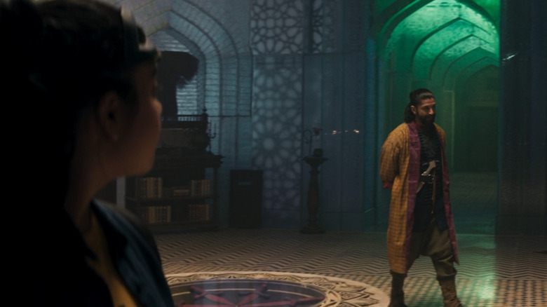 Kamala and Waleed talking in the Red Daggers' hideout