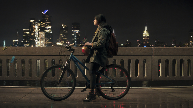 Kamala on a bike with NYC backdrop