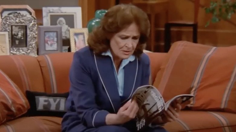 Avery Brown checks out a magazine in her daughter's house.