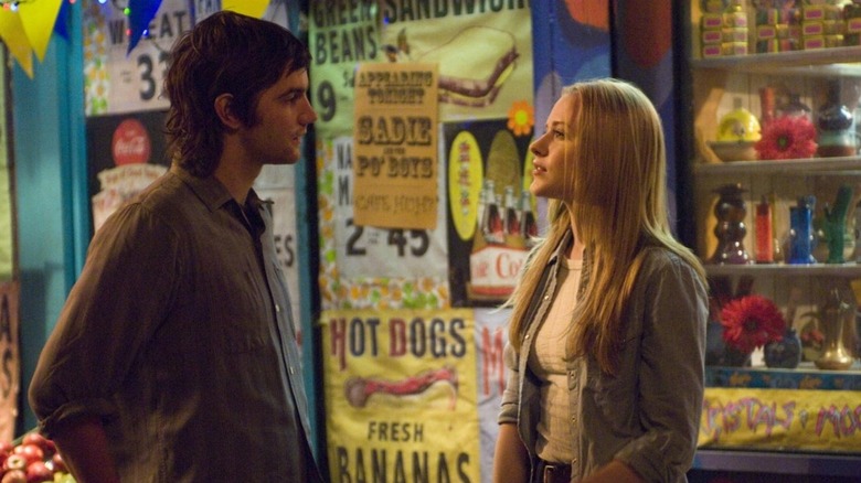 Across the Universe's (2007) two leads chatting at a carnival