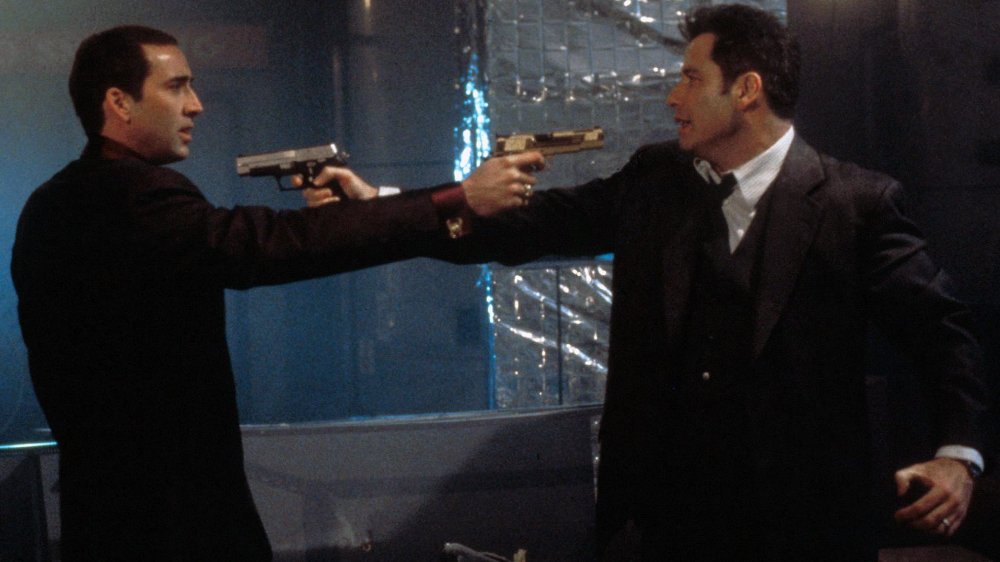 John Travolta as Sean Archer and Nicolas Cage as Castor Troy in Face/Off