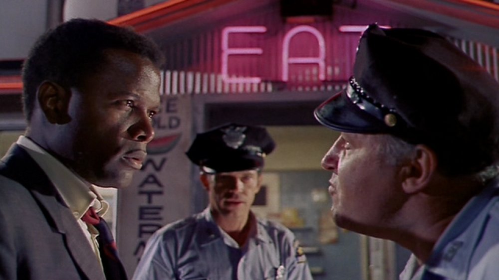 Sidney Poitier as Virgil Tibbs, Warren Oates as Sam Wood, and Rod Steiger as Chief Bill Gillespie in "In the Heat of the Night"