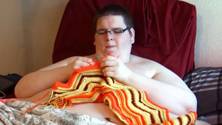 Sean Miliken knitting in bed