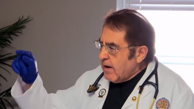 Dr. Now pointing wearing stethoscope